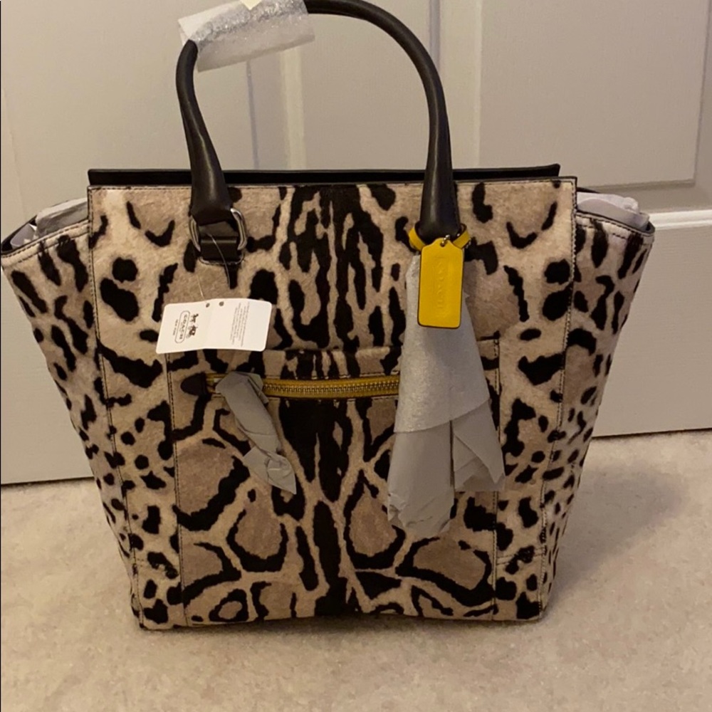 Coach cowhide large purse (new, never carried).